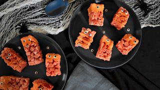 Halloween-themed orange cereal bar treats with cute eyes