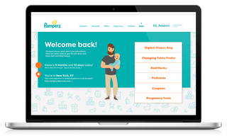 A computer with a re-designed Pampers website open. The site shows a cartoon graphic of a father holding a baby next to various buttons and information, including a button that says 'Find a changing table in your area'