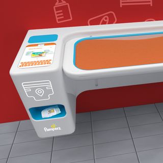 A close-up shot of one half of the diaper changing station, showing an integrated touch screen with a keyboard and the words 'Find products'
