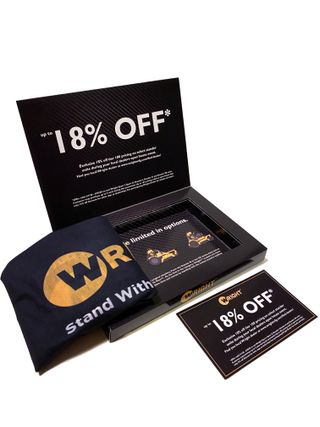 An open box with some promotional materials inside. The words 'Up to 18% off' are printed in big letters on the bottom of the lid.